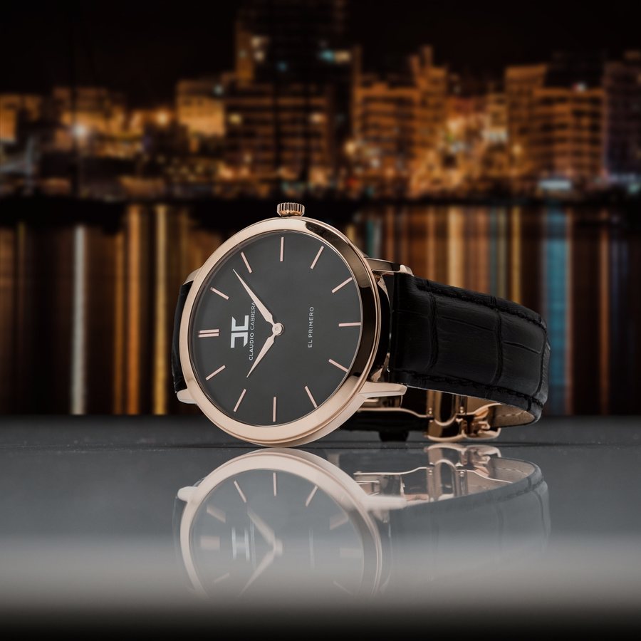 Watch in front of a city skyline at night