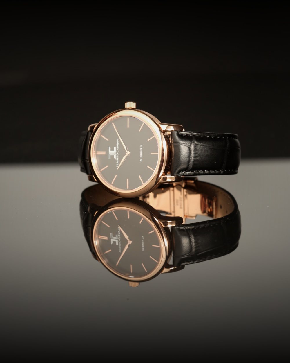 Claudio Cabrera watch seen from the side, reflected in a mirror surface